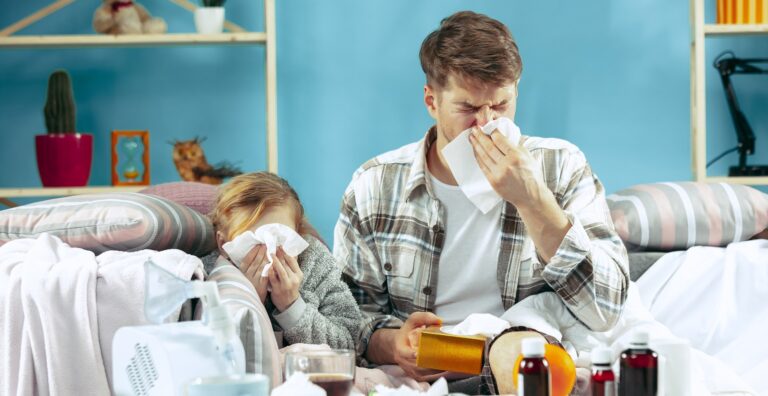 Sick man with daughter at home. The ill family.